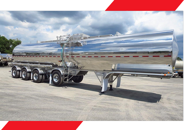 A large semi truck with a trailer on the road.